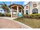 Exterior view of the Pool and Fitness Center at Sarasota National featuring manicured landscaping at 10379 Medjool Dr, Venice, FL 34293