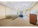 Well-lit meeting space with comfortable chairs, podium, and presentation area, perfect for community gatherings at 10379 Medjool Dr, Venice, FL 34293