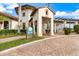 The Palm Club at Sarasota National features a beautiful entrance and inviting architecture at 10379 Medjool Dr, Venice, FL 34293
