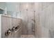 Walk-in shower with modern tile work and dual showerheads at 10379 Medjool Dr, Venice, FL 34293