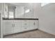 Modern bathroom featuring double vanity sinks, sleek cabinetry, and a large mirror at 17920 Palmiste Dr, Bradenton, FL 34202