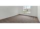 Cozy bedroom with neutral carpet, a bright window, and ample natural light at 17920 Palmiste Dr, Bradenton, FL 34202