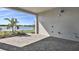 Covered patio with brick pavers, offering a shaded outdoor space with scenic lake views at 17920 Palmiste Dr, Bradenton, FL 34202