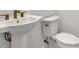 A stylish powder room featuring a pedestal sink and coordinated faucet and hardware at 17920 Palmiste Dr, Bradenton, FL 34202