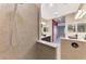 Modern bathroom featuring a large walk-in shower with a glass enclosure at 21620 Avon Park Ct, Venice, FL 34293