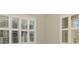 Well lit bedroom features plantation shutters at 21620 Avon Park Ct, Venice, FL 34293