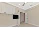 Bedroom features a ceiling fan and door to another room at 21620 Avon Park Ct, Venice, FL 34293