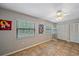 Sun-filled bonus room features tile flooring, plenty of natural light, closet and storage space at 2551 W Burr Oak Ct, Sarasota, FL 34232
