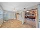 Versatile bonus room features tile floors, ample natural light, and convenient access to the main living area at 2551 W Burr Oak Ct, Sarasota, FL 34232