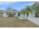 Charming one-story home featuring a well-manicured lawn and inviting curb appeal at 2551 W Burr Oak Ct, Sarasota, FL 34232
