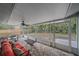 Screened patio featuring a table and chairs with a backyard view at 2551 W Burr Oak Ct, Sarasota, FL 34232