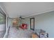Rear view of a screened in patio and outdoor seating at 2551 W Burr Oak Ct, Sarasota, FL 34232