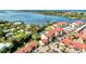 Stunning aerial view of a waterfront condo community with lush landscaping and serene water views at 1626 Stickney Point Rd # 26-102, Sarasota, FL 34231
