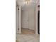 Tiled hallway entrance showcasing neutral walls and light fixture at 1626 Stickney Point Rd # 26-102, Sarasota, FL 34231