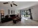 Cozy living room with a comfortable sofa and large sliding glass doors to a back patio at 1626 Stickney Point Rd # 26-102, Sarasota, FL 34231