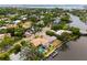 An aerial view of the neighborhood featuring waterfront access and the city skyline in the background at 1810 Lincoln Dr, Sarasota, FL 34236