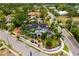 Stunning aerial view of a beautiful multi-story home, with lush tropical landscaping, and a charming gated entrance at 1810 Lincoln Dr, Sarasota, FL 34236