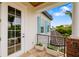 Cozy balcony with brick accents, planter boxes, and a view of the lush surroundings at 1810 Lincoln Dr, Sarasota, FL 34236