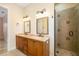 Bright bathroom featuring dual sinks and a large walk-in shower at 1810 Lincoln Dr, Sarasota, FL 34236