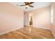 Bedroom with hardwood floors and bathroom access at 1810 Lincoln Dr, Sarasota, FL 34236