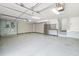 Spacious garage with custom storage cabinets and epoxy flooring at 1810 Lincoln Dr, Sarasota, FL 34236