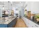 Elegant kitchen featuring large granite island, stainless appliances, and custom cabinetry at 1810 Lincoln Dr, Sarasota, FL 34236