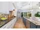 Gorgeous kitchen with granite countertops, gas range, stainless steel appliances, and white cabinets at 1810 Lincoln Dr, Sarasota, FL 34236