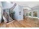 Open living space with a decorative staircase and seamless access to outdoor pool and patio at 1810 Lincoln Dr, Sarasota, FL 34236