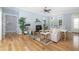 Comfortable living space featuring a fireplace, hardwood floors, and a bright, airy atmosphere at 1810 Lincoln Dr, Sarasota, FL 34236