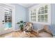 Sitting area with large windows, plantation shutters, and views of the pool at 1810 Lincoln Dr, Sarasota, FL 34236