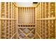 Spacious wine cellar featuring natural wood racking and ample storage space at 1810 Lincoln Dr, Sarasota, FL 34236