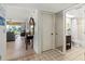 Bathroom, showing vanity, mirror, and tub-shower combination, adjacent to open concept living space at 5697 Sheffield Greene Cir # 51, Sarasota, FL 34235