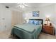 Comfortable bedroom with a bed, side tables, and a closet, providing a relaxing and private space at 5697 Sheffield Greene Cir # 51, Sarasota, FL 34235