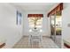 Cozy dining area features a white table set, a window with a view, and access to the patio at 5697 Sheffield Greene Cir # 51, Sarasota, FL 34235