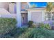 Condo exterior featuring well-maintained landscaping and a covered entryway at 5697 Sheffield Greene Cir # 51, Sarasota, FL 34235