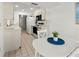 Well-lit kitchen with modern appliances, white cabinets, and adjacent dining area for convenient meals at 5697 Sheffield Greene Cir # 51, Sarasota, FL 34235