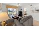 Comfortable living room with plush seating and sliding glass doors to the patio at 5697 Sheffield Greene Cir # 51, Sarasota, FL 34235