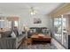 Relaxing living room with comfortable seating and access to a screened patio at 5697 Sheffield Greene Cir # 51, Sarasota, FL 34235