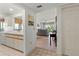 Open-concept living room with tile flooring, neutral walls, and access to kitchen and outdoor patio at 5697 Sheffield Greene Cir # 51, Sarasota, FL 34235
