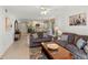 Spacious living room with views into the kitchen and access to an outdoor patio at 5697 Sheffield Greene Cir # 51, Sarasota, FL 34235