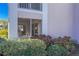 Private patio with a sitting area surrounded by colorful foliage, perfect for enjoying peaceful moments at 5697 Sheffield Greene Cir # 51, Sarasota, FL 34235