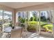 Charming patio featuring outdoor seating and views of lush landscaping at 5697 Sheffield Greene Cir # 51, Sarasota, FL 34235