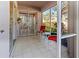 Enjoy outdoor relaxation on this screened patio with tile flooring and comfortable seating at 5697 Sheffield Greene Cir # 51, Sarasota, FL 34235