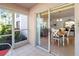 View from the screened patio looking into the living and dining areas, providing an indoor-outdoor feel at 5697 Sheffield Greene Cir # 51, Sarasota, FL 34235