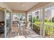 Inviting patio with comfortable seating and views of lush greenery at 5697 Sheffield Greene Cir # 51, Sarasota, FL 34235