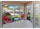 Inviting screened porch with outdoor seating offers a relaxing space to enjoy the community views at 5697 Sheffield Greene Cir # 51, Sarasota, FL 34235