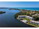 An aerial view shows the beautiful condo complex overlooking the bay at 605 Sutton Pl # 205, Longboat Key, FL 34228