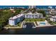 Waterfront condominium boasts private boat docks and community pool, with scenic water views at 605 Sutton Pl # 205, Longboat Key, FL 34228