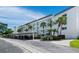 Lovely condominium complex with covered parking, beautiful landscaping, and beach access at 605 Sutton Pl # 205, Longboat Key, FL 34228