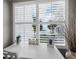 Desk area with shutters showing beach view at 605 Sutton Pl # 205, Longboat Key, FL 34228